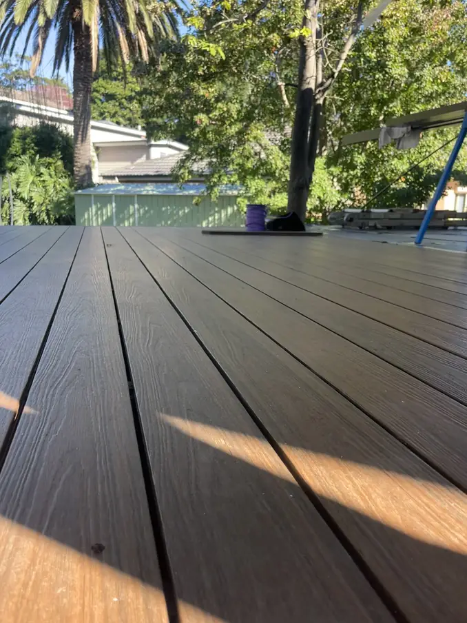 Close-up of newly laid deck boards in afternoon light