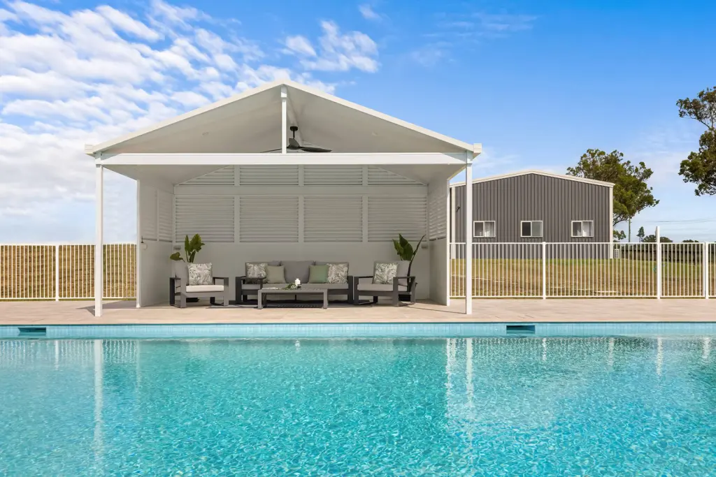 Louvered privacy screen on gable patio